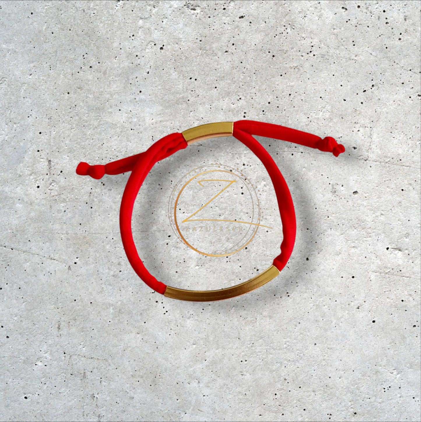 Pulsera en licra con detalle dorado